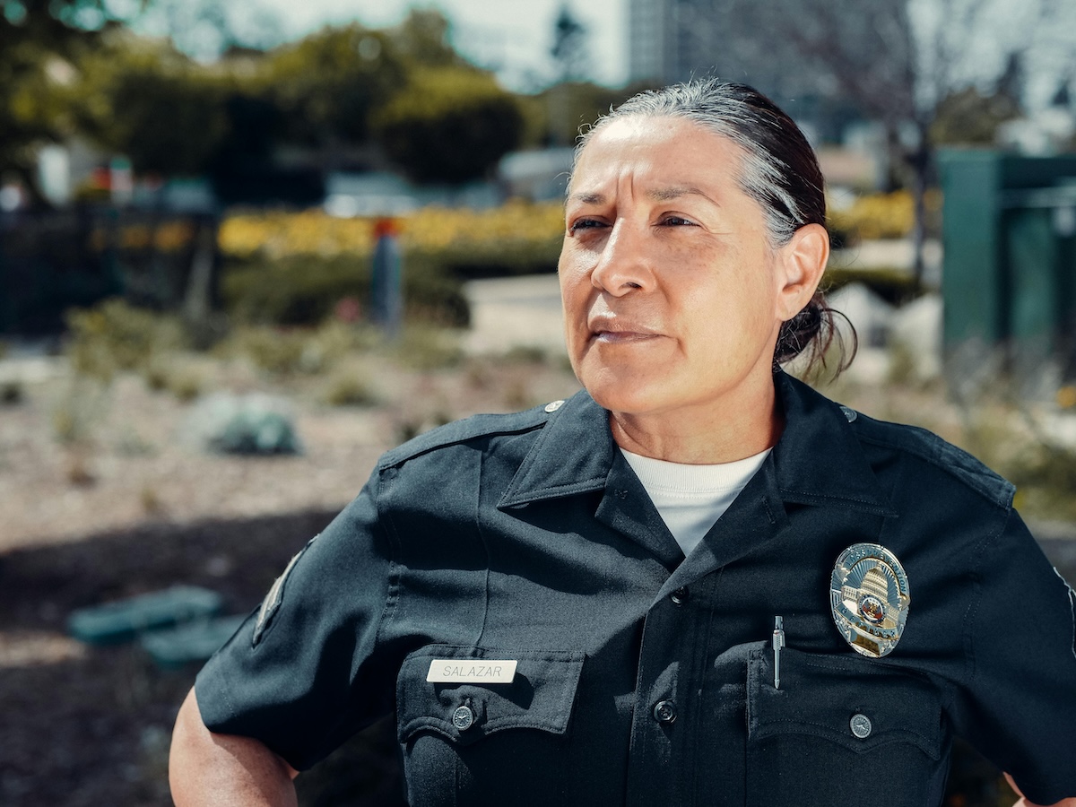 uniformed police woman with badge and name tag